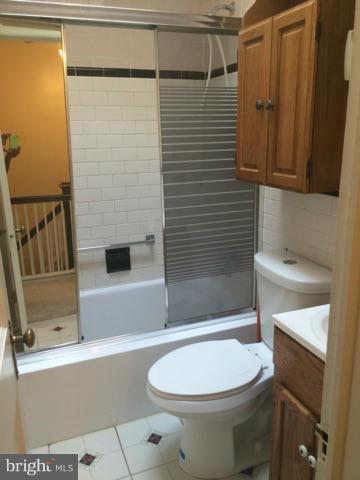 3810 Flowerton Road Baltimore, MD 21229 - Photo 9 of 20 a bathroom with a toilet and shower