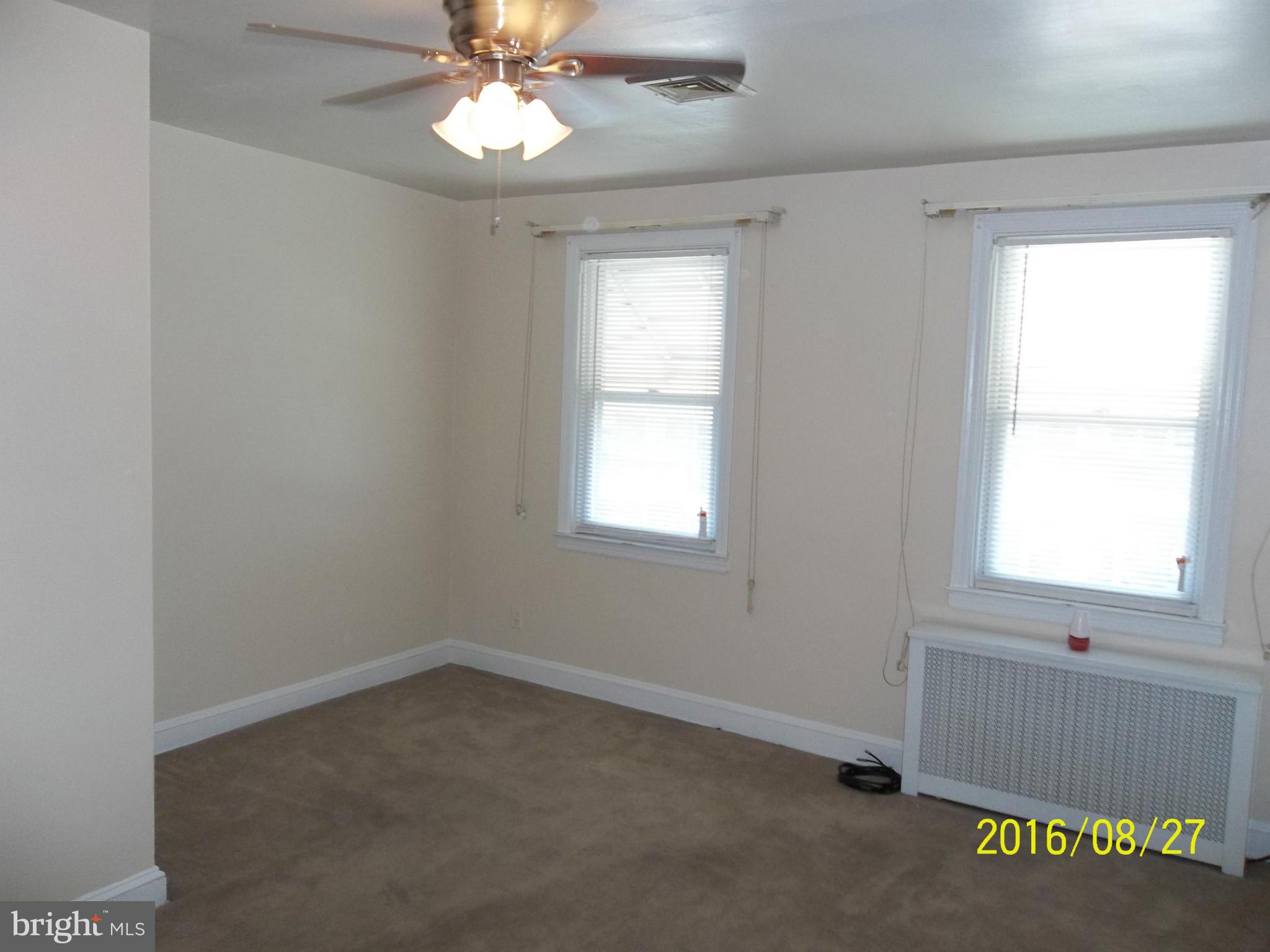 3810 Flowerton Road Baltimore, MD 21229 - Photo 10 of 20 an empty room with a window and a fan