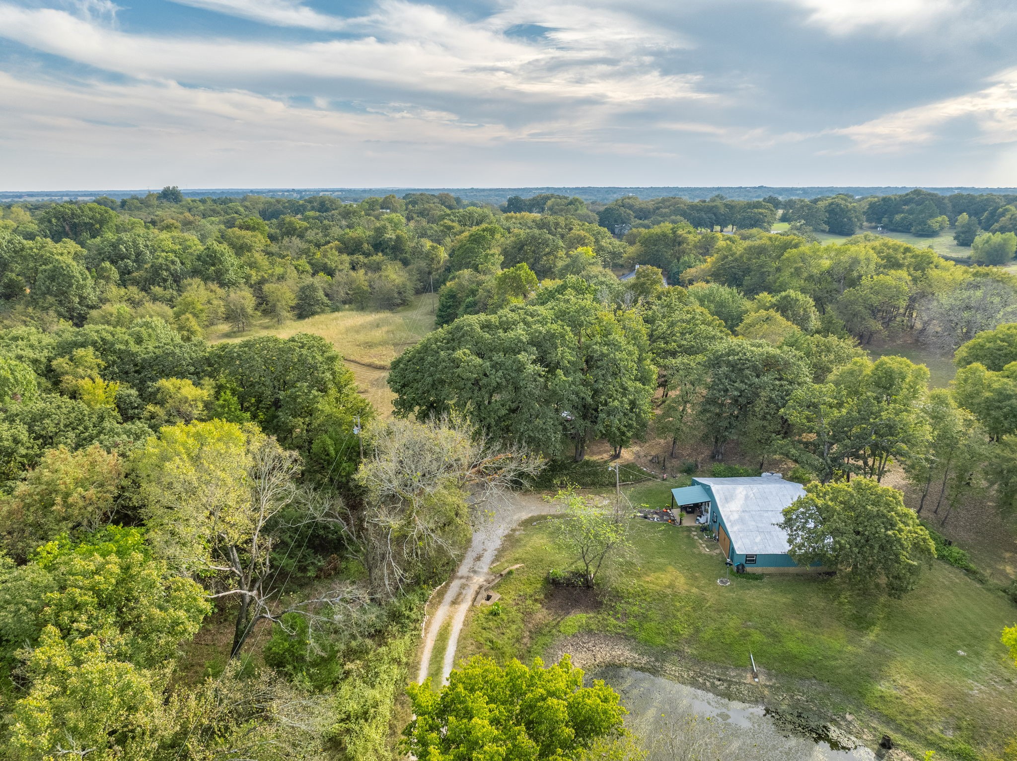 312 Magnus Road Denison, TX 75021 - Photo 19 of 50 a view of a lake with a city