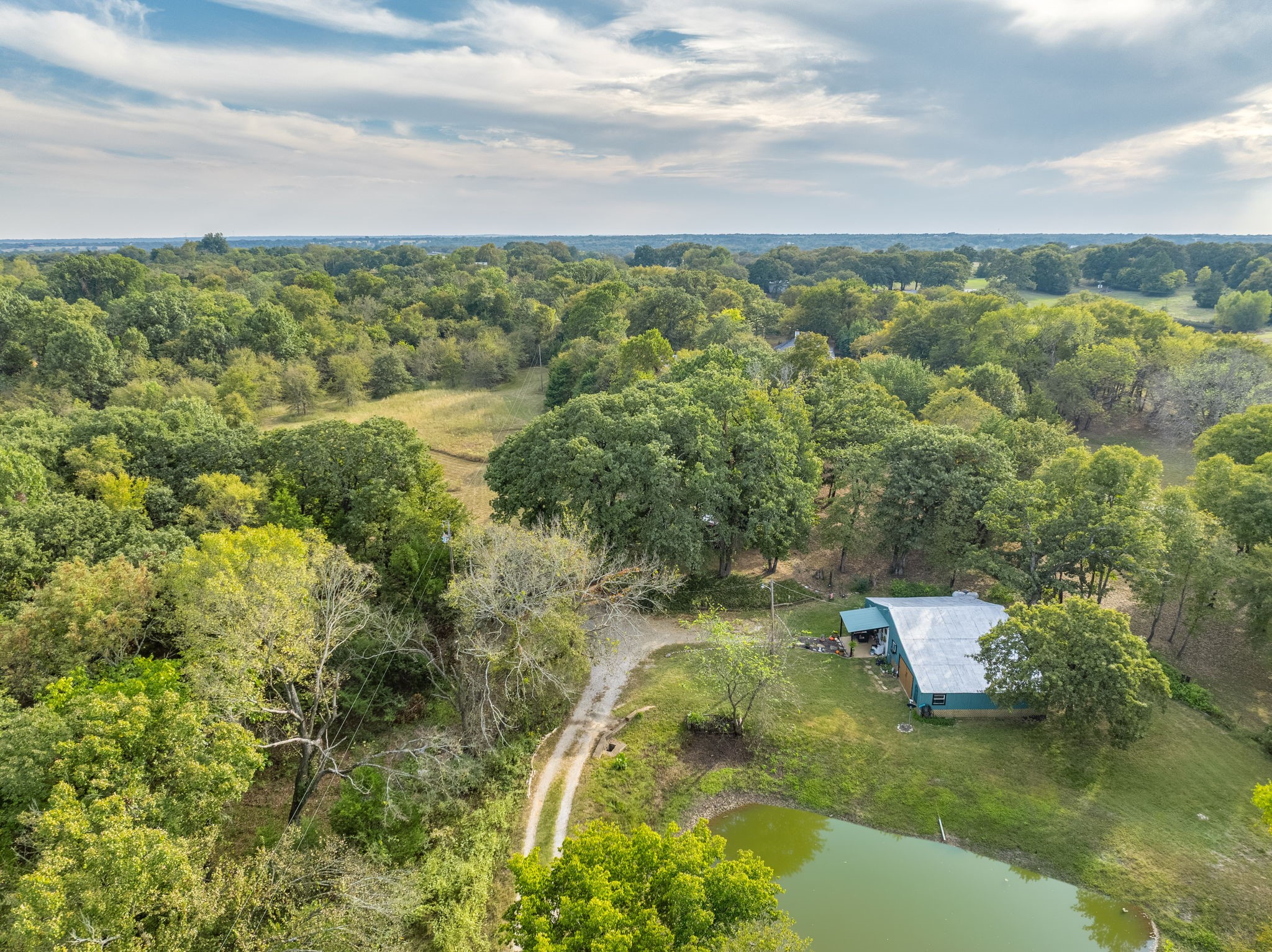 312 Magnus Road Denison, TX 75021 - Photo 20 of 50 a view of a lake with a city