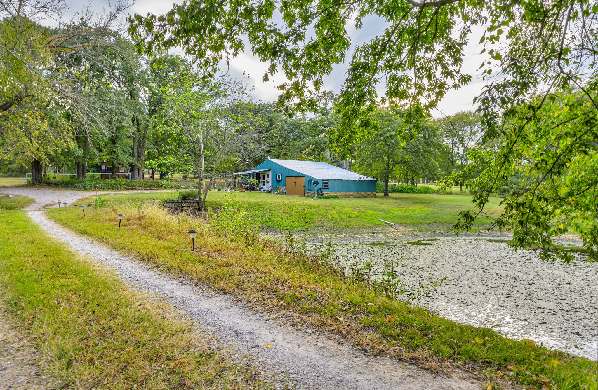 312 Magnus Road Denison, TX 75021 - Photo 28 of 50 a view of a swimming pool with a yard