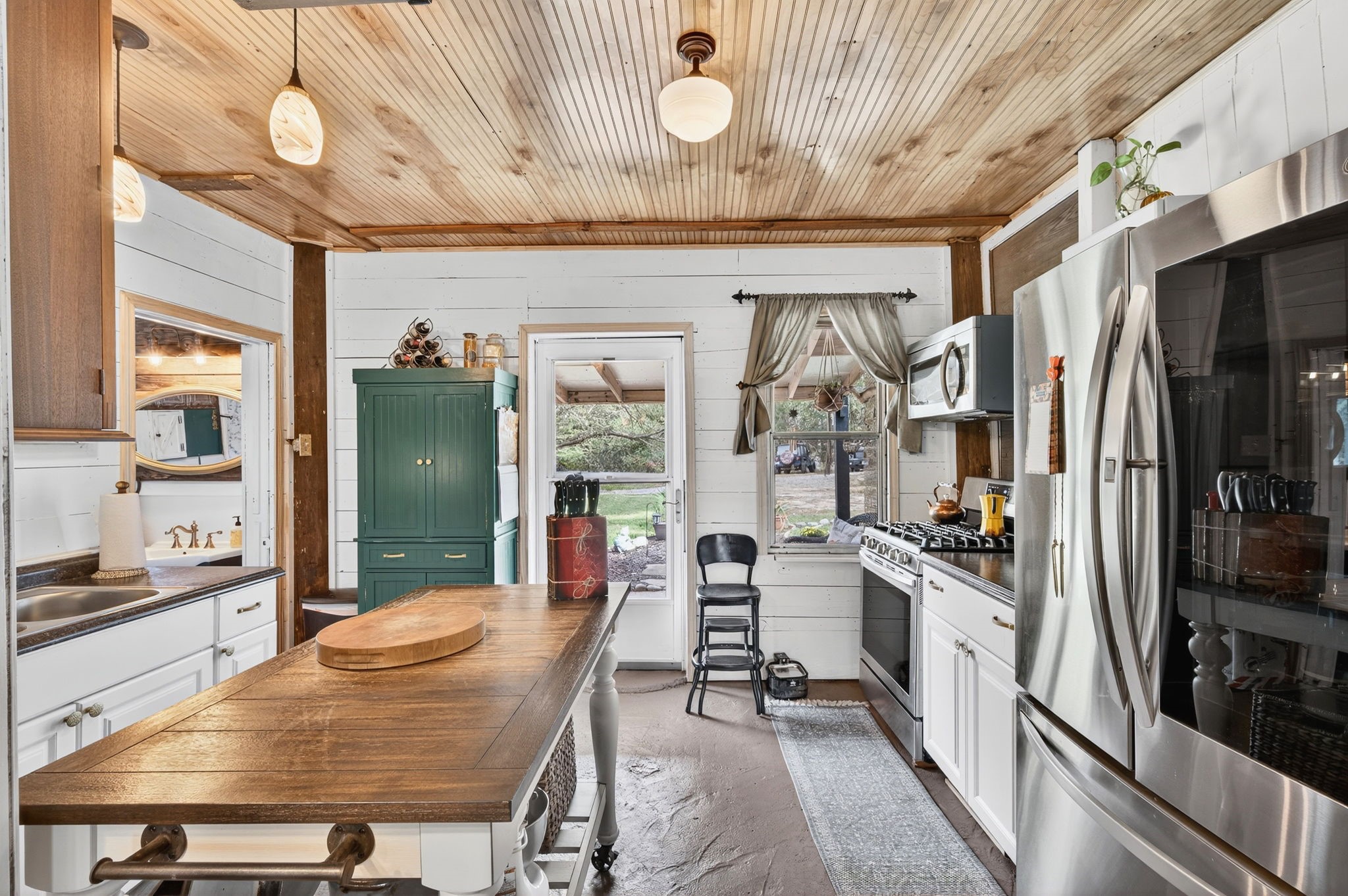 312 Magnus Road Denison, TX 75021 - Photo 35 of 50 a kitchen with stainless steel appliances granite countertop a sink stove and refrigerator