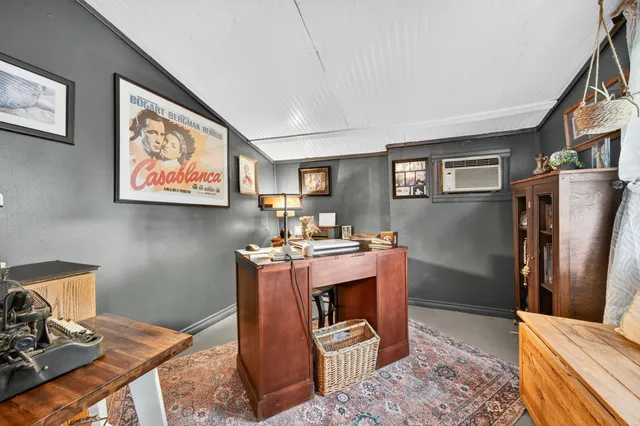 a workspace with furniture and a rug