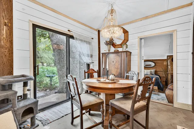a view of a dining room with furniture window and outside view
