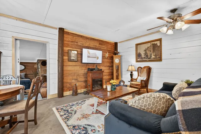 a living room with furniture and a table