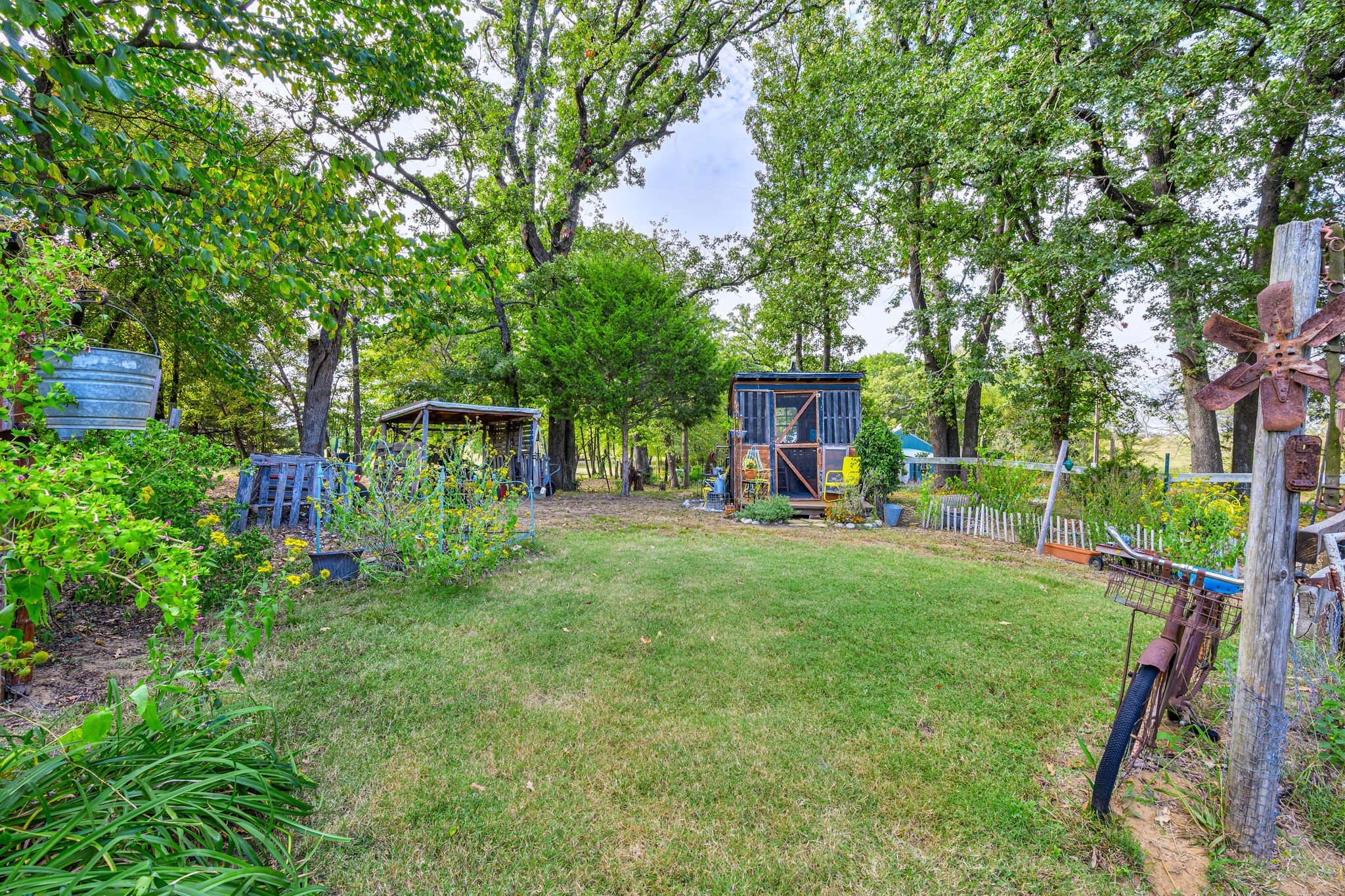 312 Magnus Road Denison, TX 75021 - Photo 6 of 50 a view of a house with backyard and sitting area