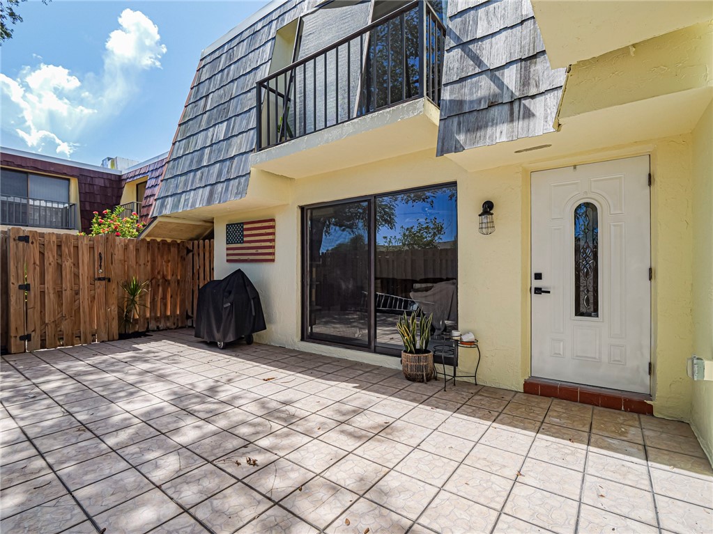 1170 6th Avenue, Unit 8B Vero Beach, FL 32960 - Photo 4 of 24 a view of a house with backyard porch and sitting area