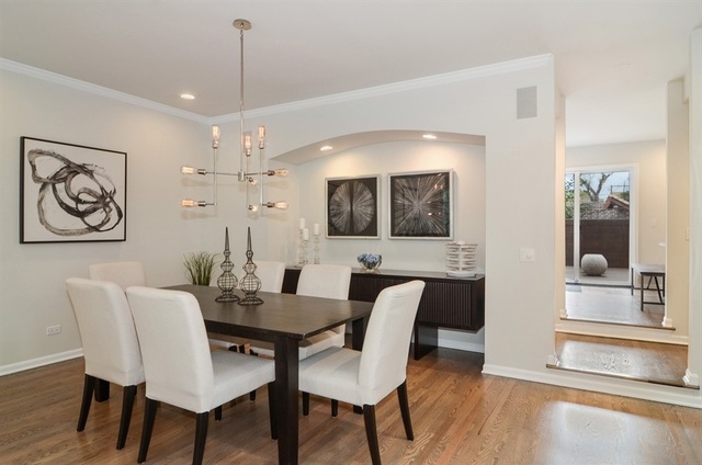 1014 West Grace Street Chicago, IL 60613 - Photo 12 of 24 a view of a a dining room with furniture window and wooden floor