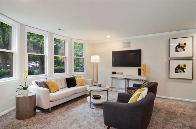 1014 West Grace Street Chicago, IL 60613 - Photo 13 of 24 a living room with furniture and a flat screen tv