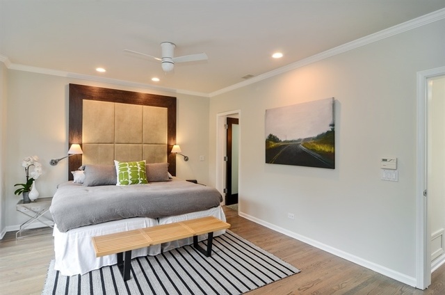 1014 West Grace Street Chicago, IL 60613 - Photo 18 of 24 a living room with a couch and a flat screen tv