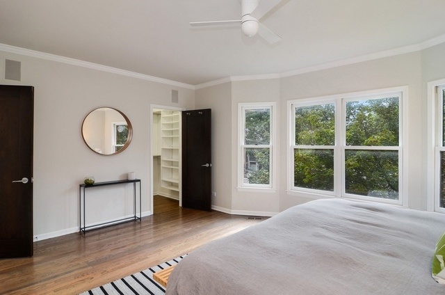 1014 West Grace Street Chicago, IL 60613 - Photo 21 of 24 a view of a bedroom with furniture window and a wooden floor