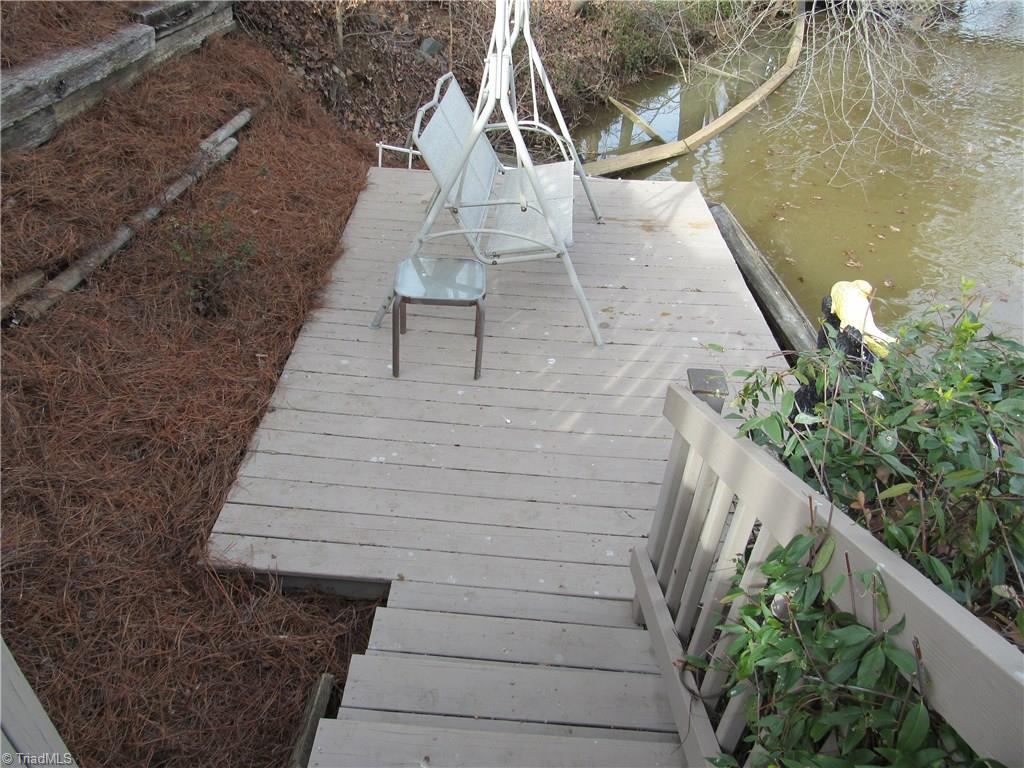 2136 Riverview Rd Extension Lexington, NC 27292 - Photo 12 of 28 As you make your way down to the dock you will discover a lakeside deck that is almost over the water.