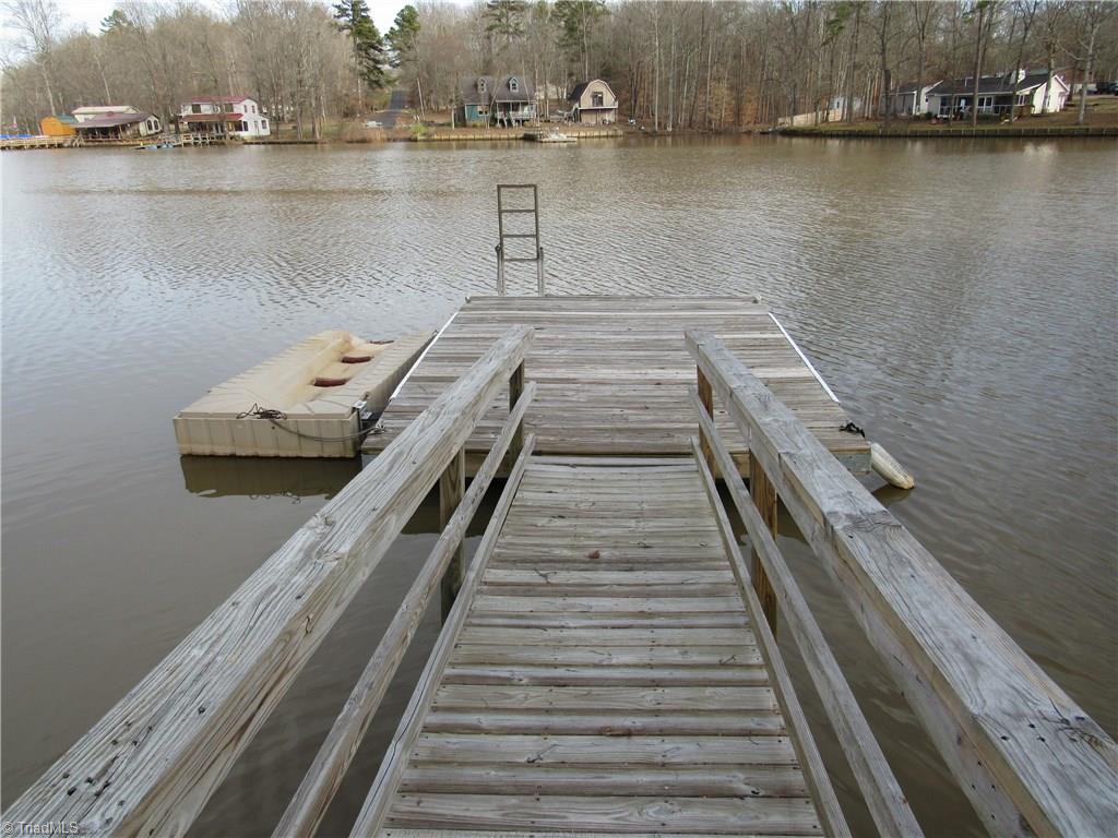 2136 Riverview Rd Extension Lexington, NC 27292 - Photo 15 of 28 Park your pontoon boat at your floater and simply jump aboard, turn the keye, and cruise the 8 mile lake. Go to one of the two restaurants on the lake for dinner.