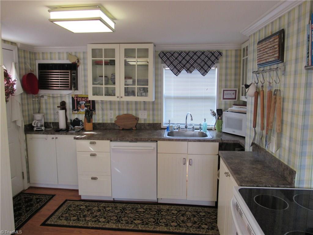 2136 Riverview Rd Extension Lexington, NC 27292 - Photo 17 of 28 The kitchen is compact and convenient but with all the things you need for a great weekend. Not interested in cooking? Call Smiley's pizza and they will deliver a delicious pizza or or a couple of Philly Cheese Steaks to your door.