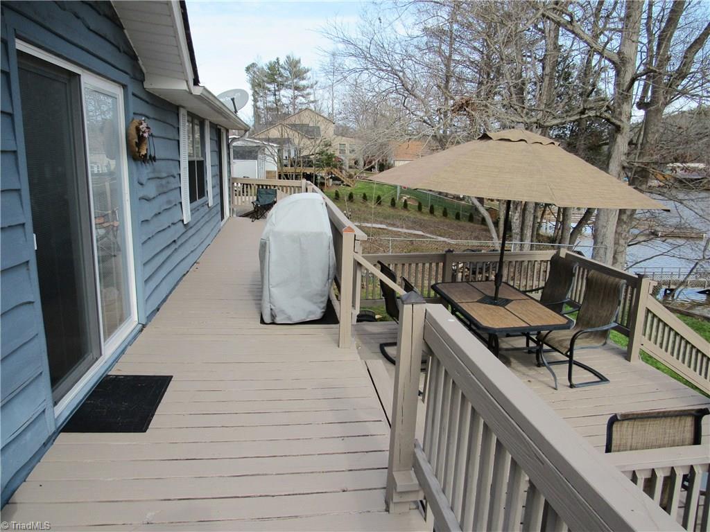 2136 Riverview Rd Extension Lexington, NC 27292 - Photo 4 of 28 Full length deck with an entrance to the living area and the master bedroom.