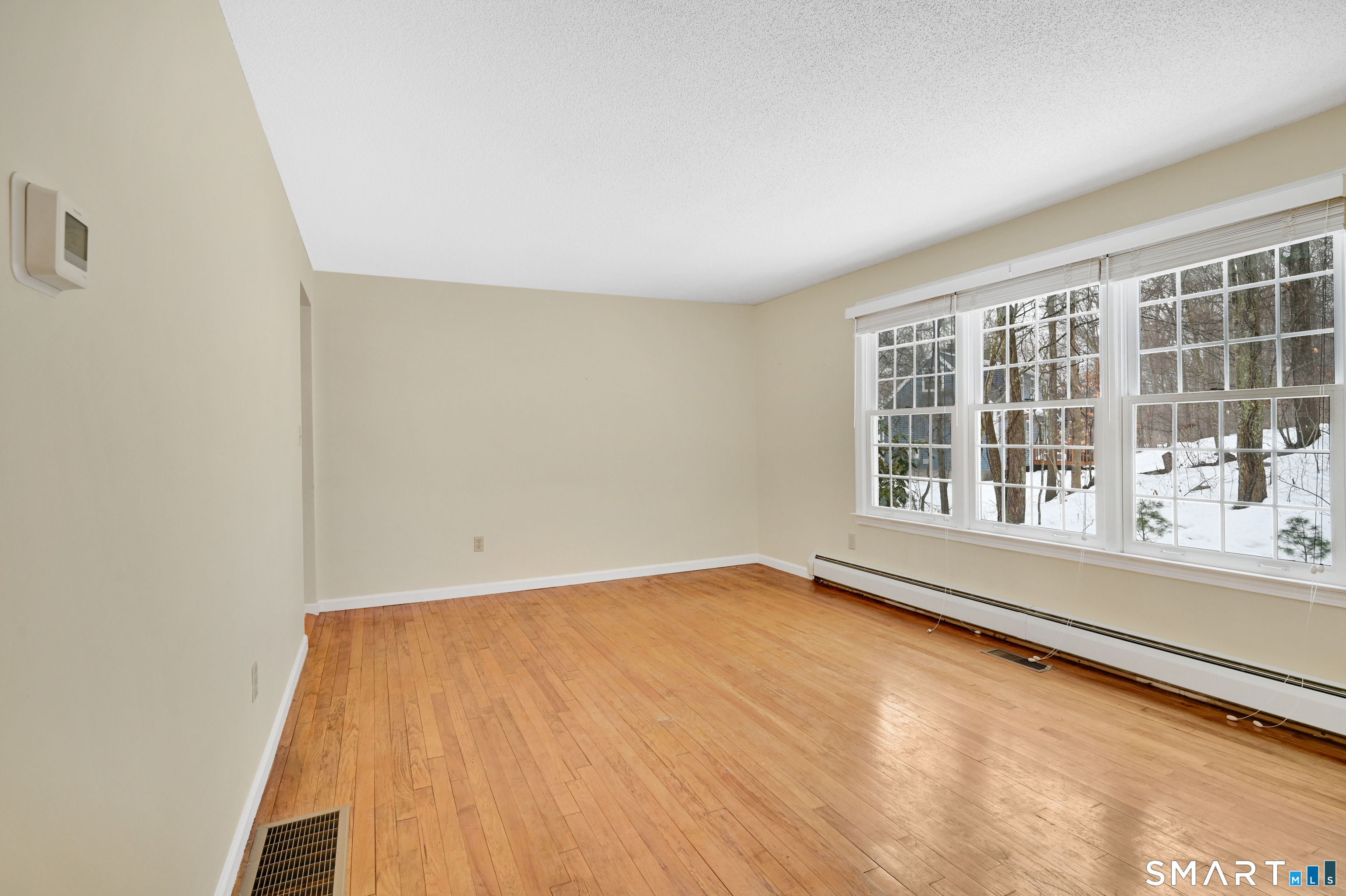 743 Green Hill Road Madison, CT 06443 - Photo 11 of 39 an empty room with a window