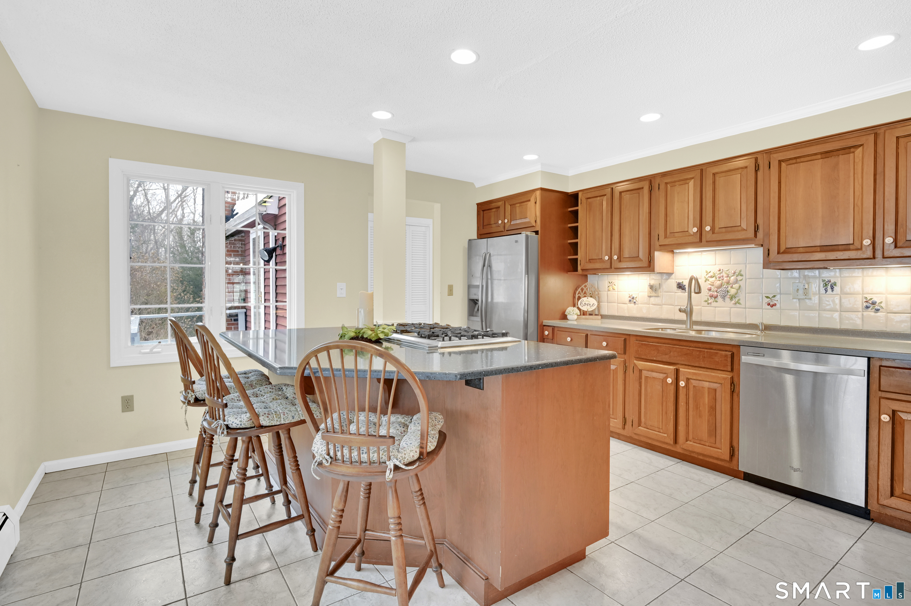 743 Green Hill Road Madison, CT 06443 - Photo 17 of 39 a kitchen with stainless steel appliances granite countertop a stove a sink dishwasher and a refrigerator