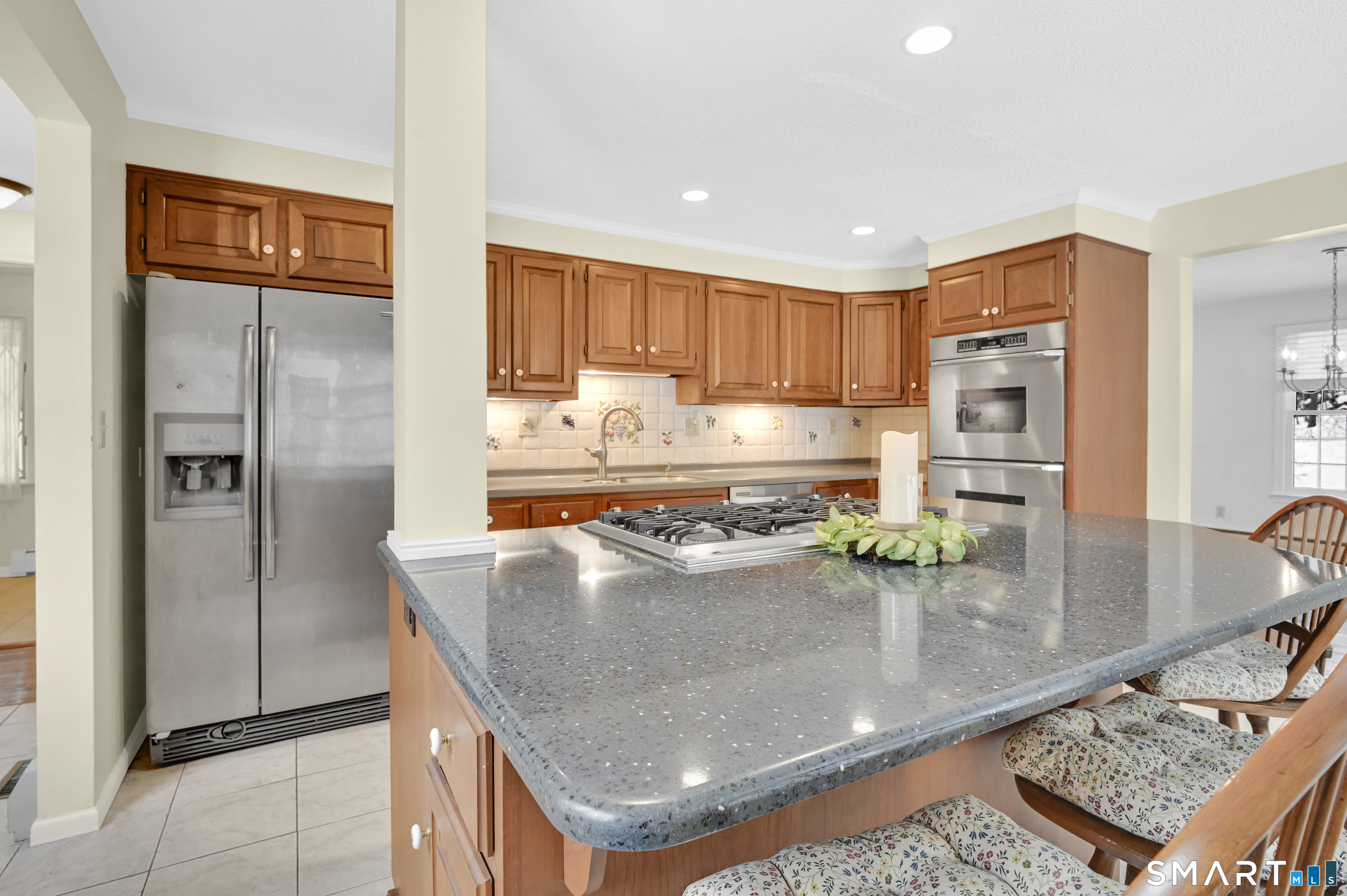 743 Green Hill Road Madison, CT 06443 - Photo 18 of 39 a kitchen with stainless steel appliances granite countertop a refrigerator and a stove