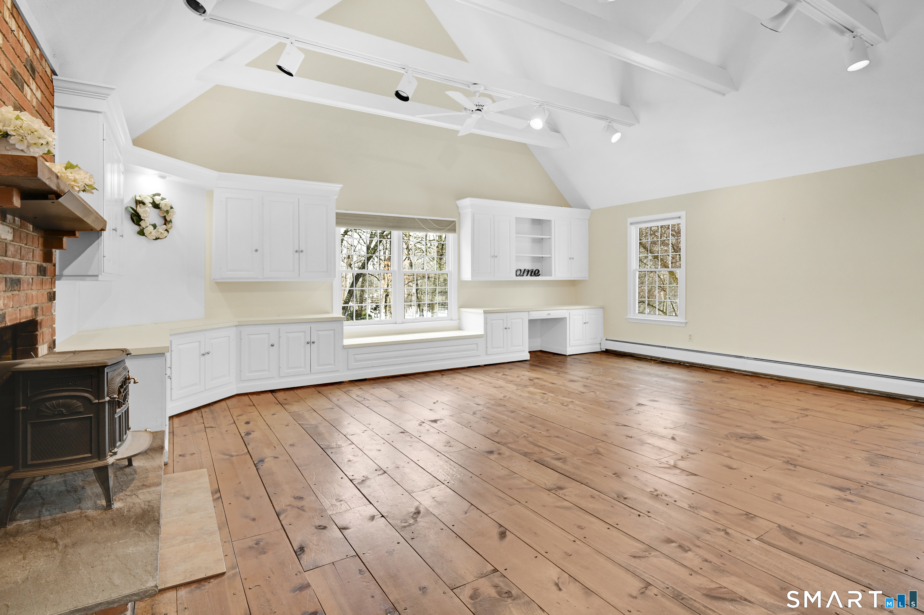 743 Green Hill Road Madison, CT 06443 - Photo 22 of 39 a view of a kitchen and an empty room with a window