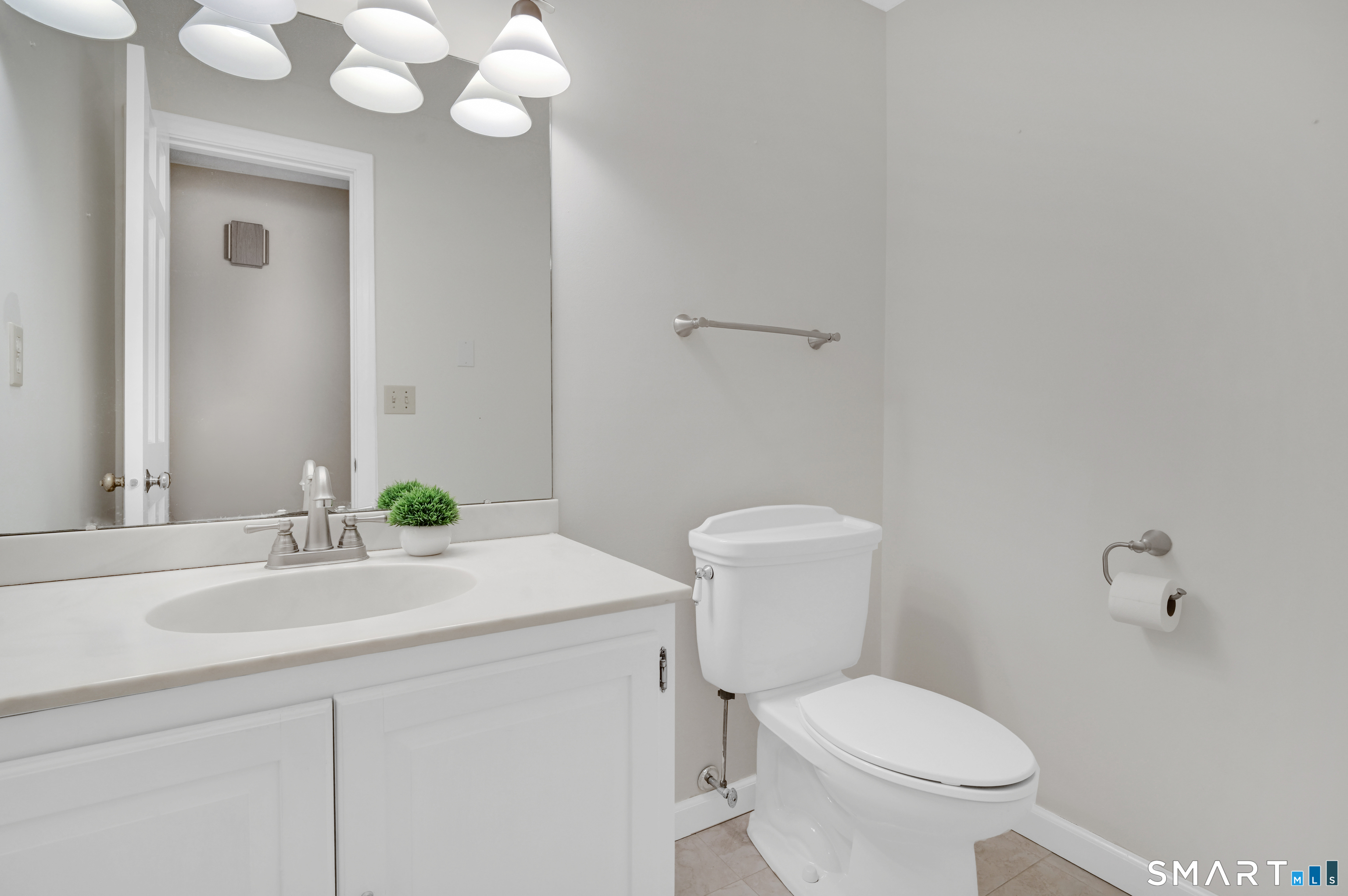 743 Green Hill Road Madison, CT 06443 - Photo 25 of 39 a bathroom with a granite countertop toilet sink and mirror