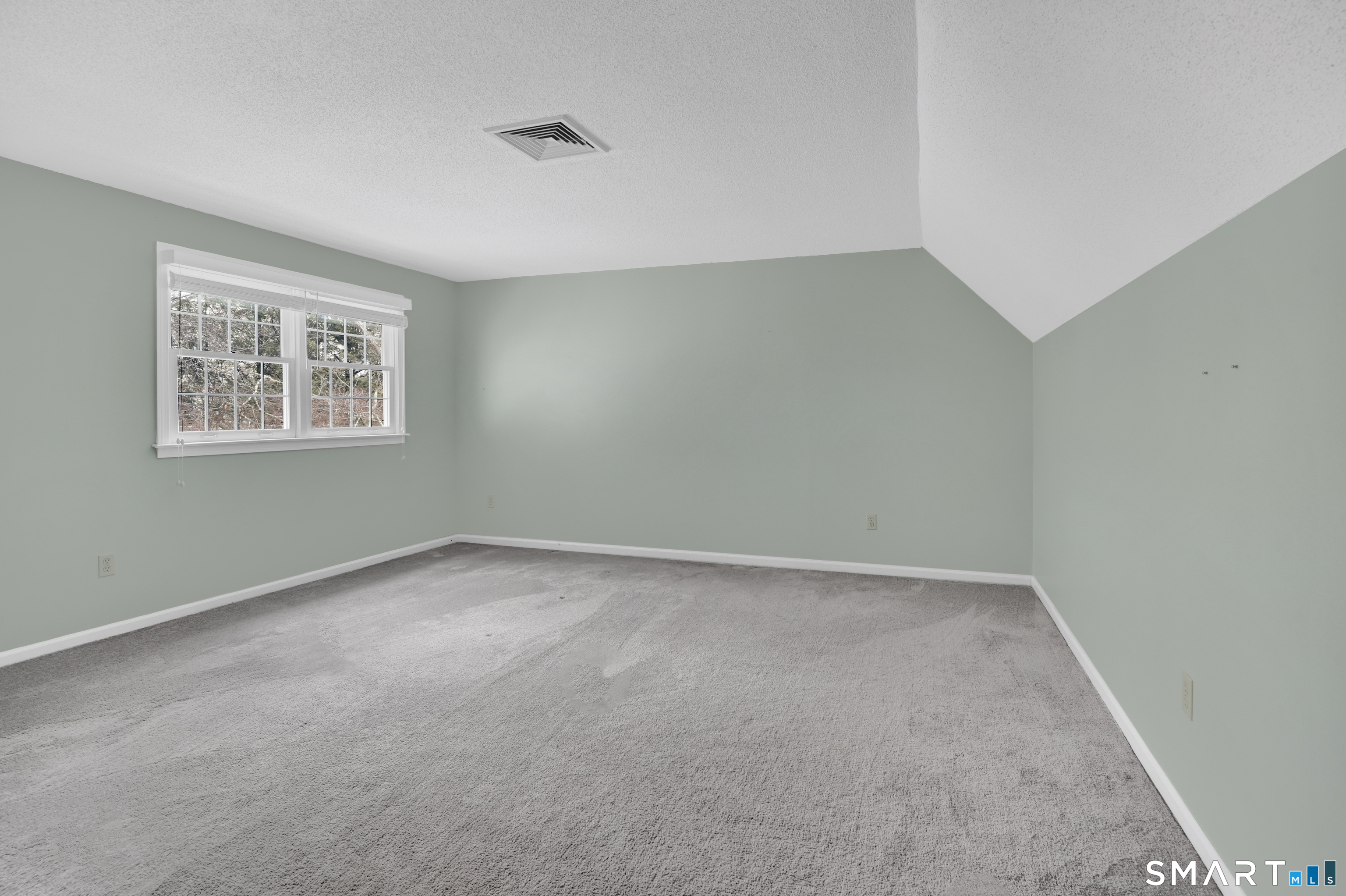 743 Green Hill Road Madison, CT 06443 - Photo 26 of 39 an empty room with a window