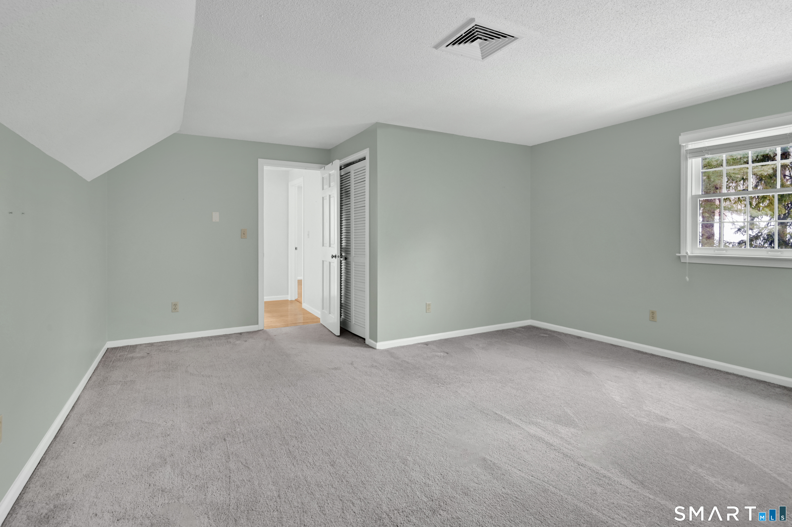 743 Green Hill Road Madison, CT 06443 - Photo 27 of 39 a view of an empty room with a window