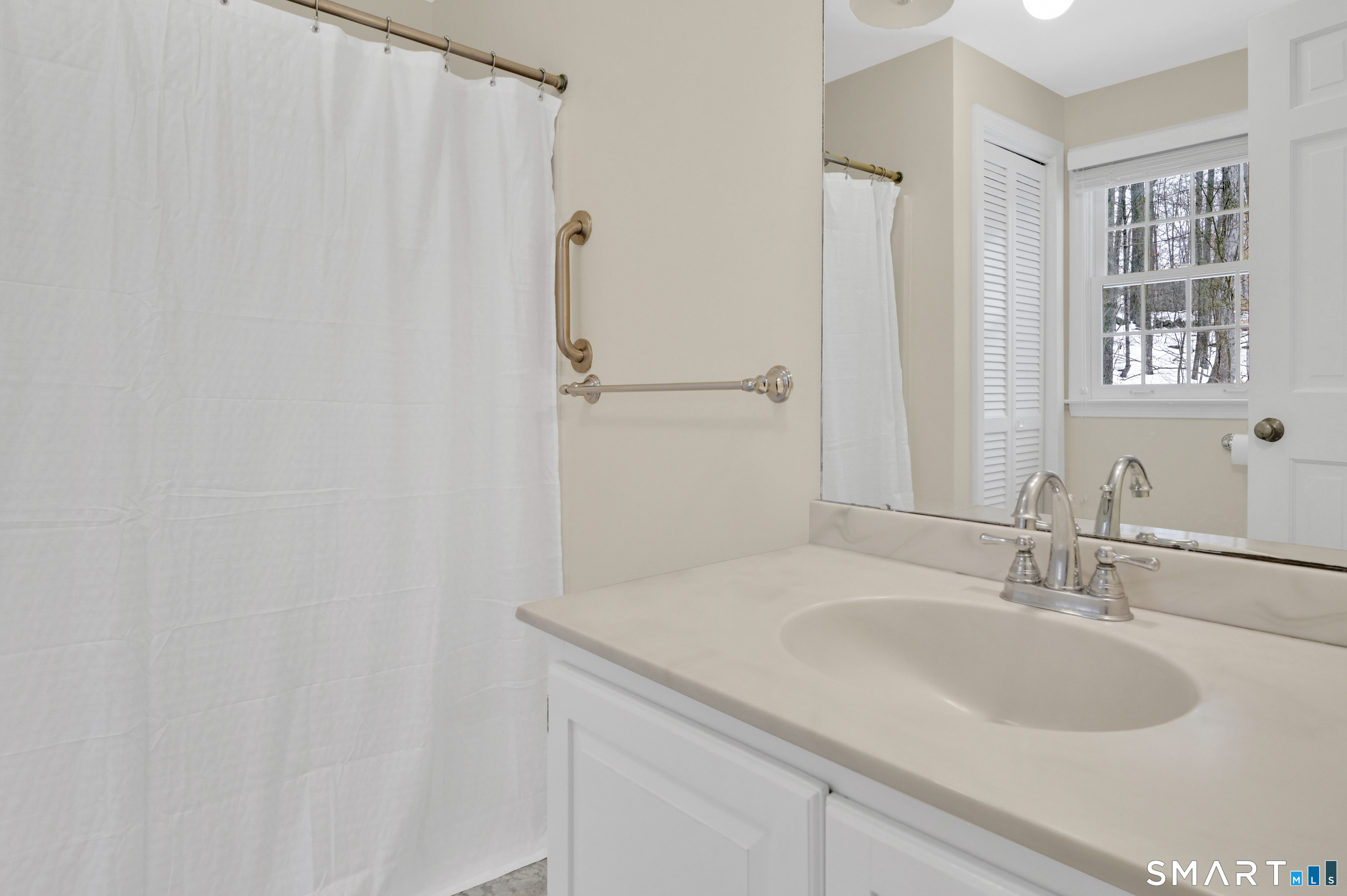 743 Green Hill Road Madison, CT 06443 - Photo 33 of 39 a bathroom with a sink and a mirror