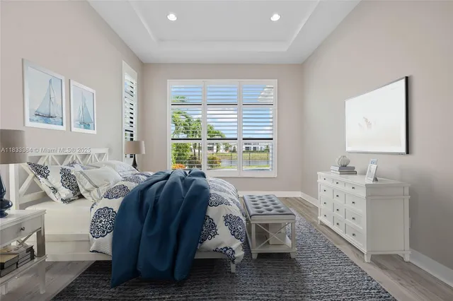 a bed room with a bed and a window