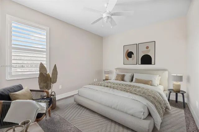 a bedroom with a bed and chair