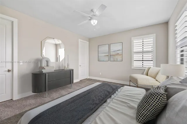 a bedroom with a large bed and furniture