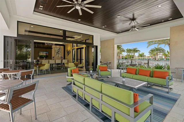 a room with lots of wooden furniture and a chandelier