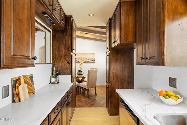 a view of kitchen with furniture and natural light
