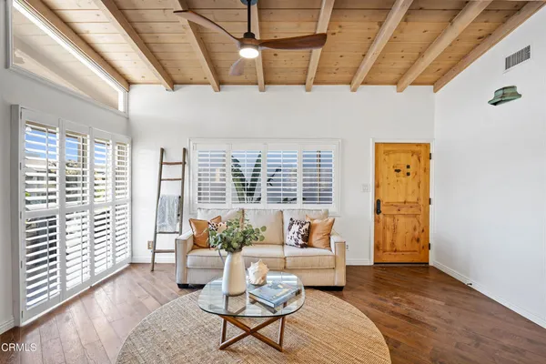 a living room with furniture and a window