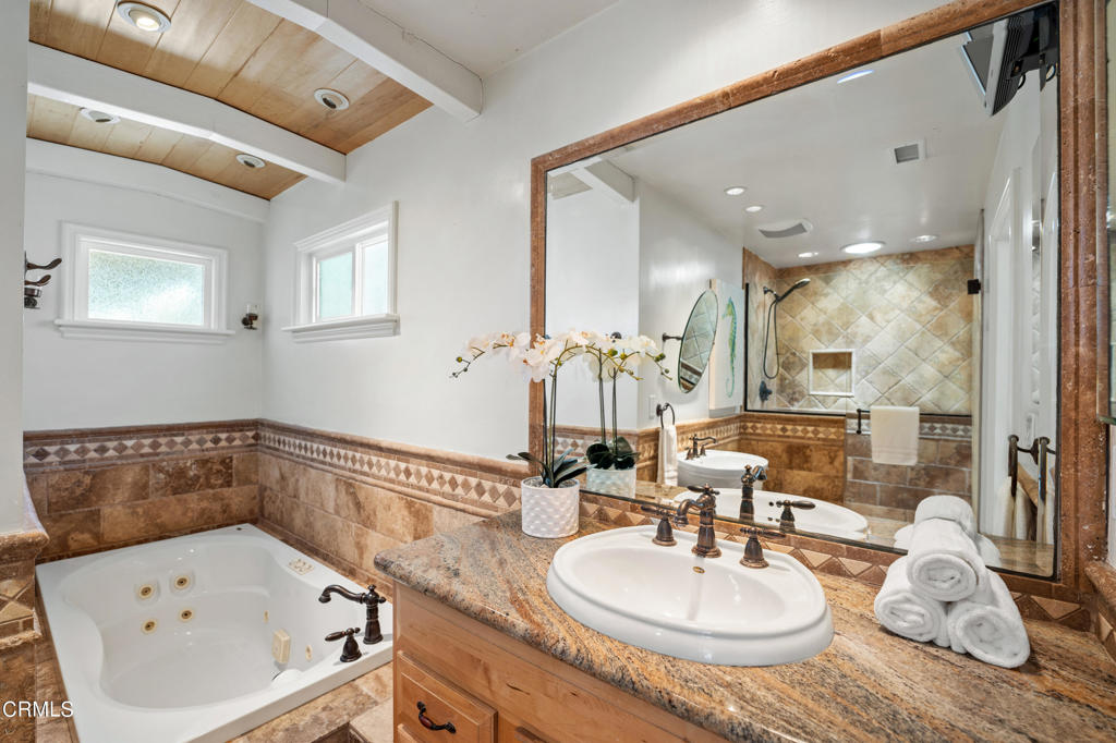3715 Sunset Lane Oxnard, CA 93035 - Photo 24 of 45 a bathroom with a sink and a mirror