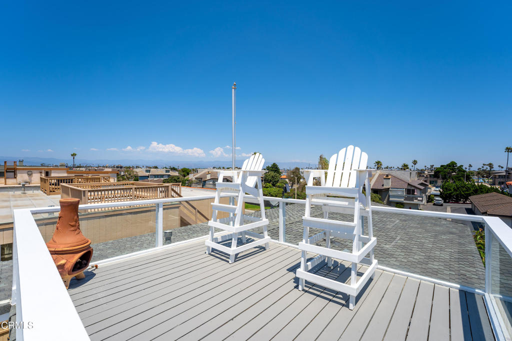 3715 Sunset Lane Oxnard, CA 93035 - Photo 25 of 45 a view of a balcony with wooden floor and seating space