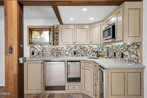 a bathroom with a sink vanity and mirror