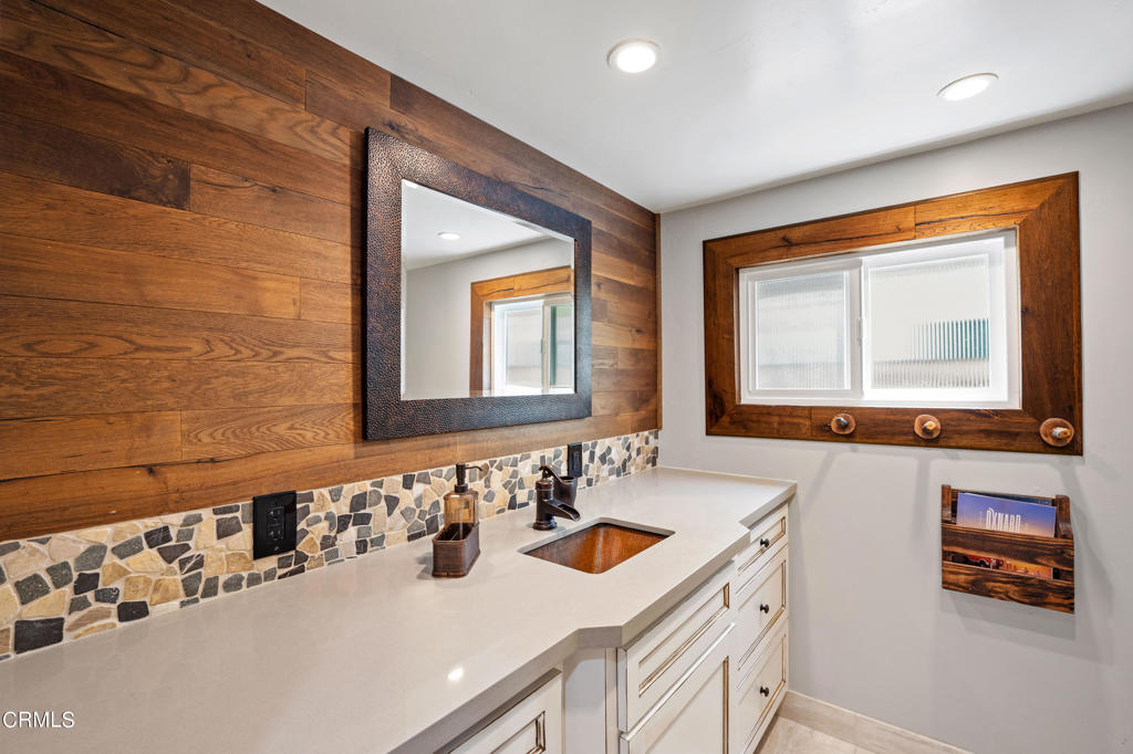 3715 Sunset Lane Oxnard, CA 93035 - Photo 33 of 45 a bathroom with a sink vanity and mirror