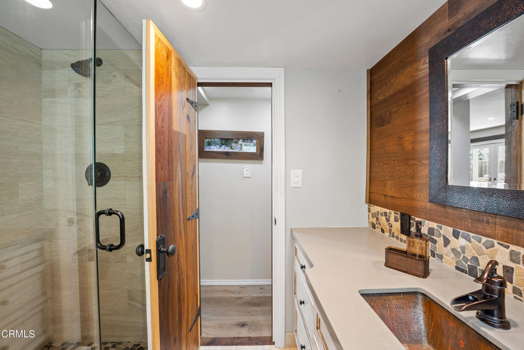 3715 Sunset Lane Oxnard, CA 93035 - Photo 34 of 45 a bathroom with a sink and a mirror