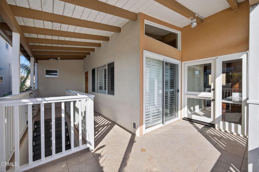 3715 Sunset Lane Oxnard, CA 93035 - Photo 38 of 45 a view of a porch with wooden floor and stairs