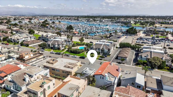 an aerial view of a city and ocean view