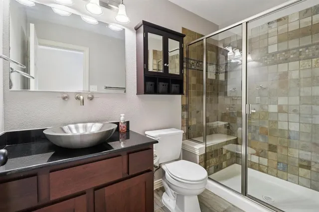 a bathroom with a bathtub and toilet