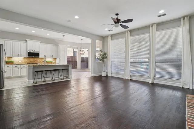a view of kitchen with cabinets and wooden floor