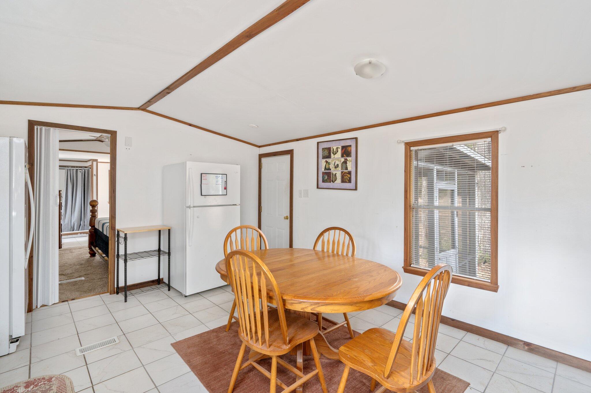 4507 Rainbird Rise Road Crestview, FL 32539 - Photo 11 of 33 a view of a dining room with furniture