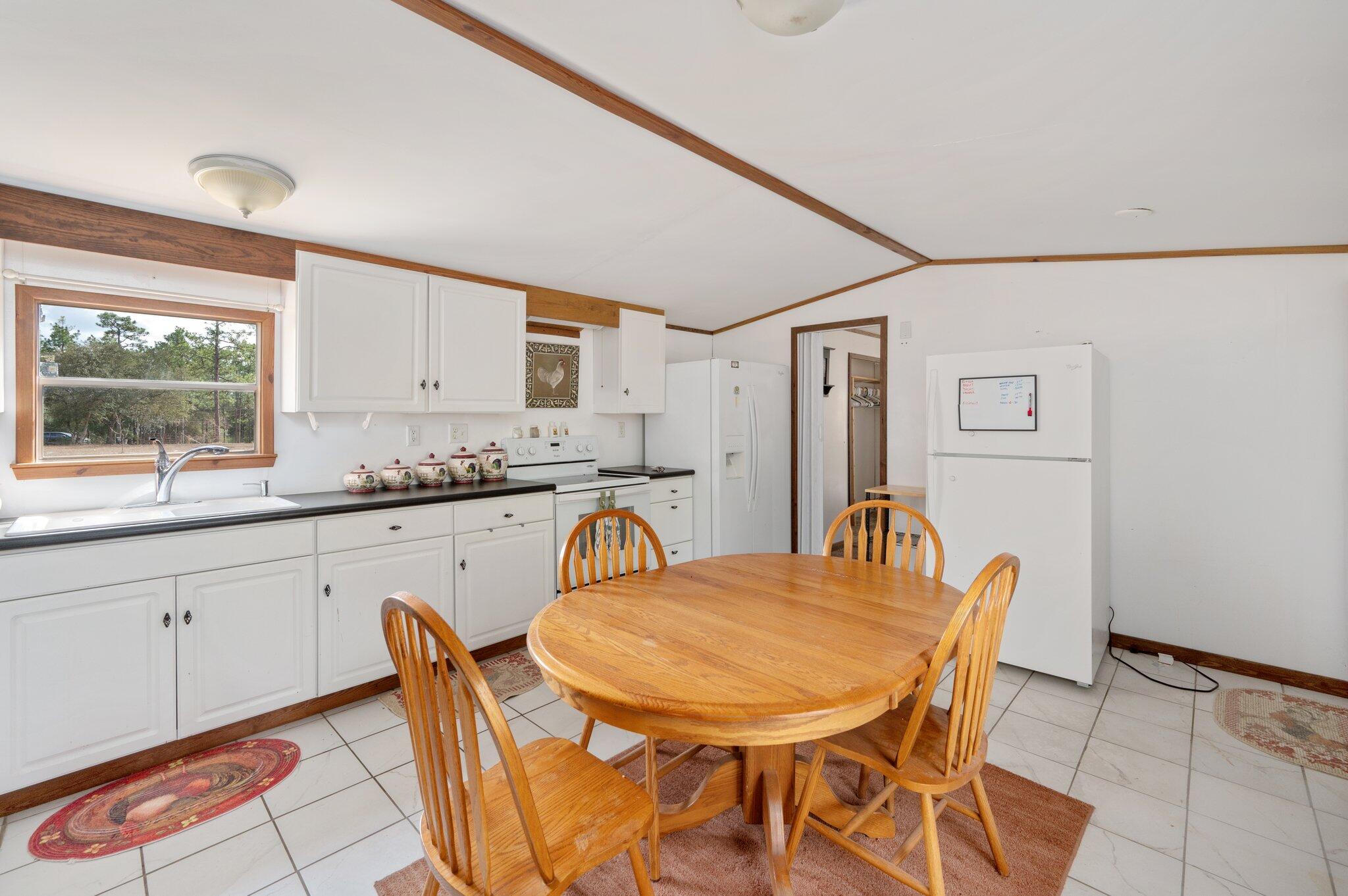 4507 Rainbird Rise Road Crestview, FL 32539 - Photo 12 of 33 a view of a dining room with furniture