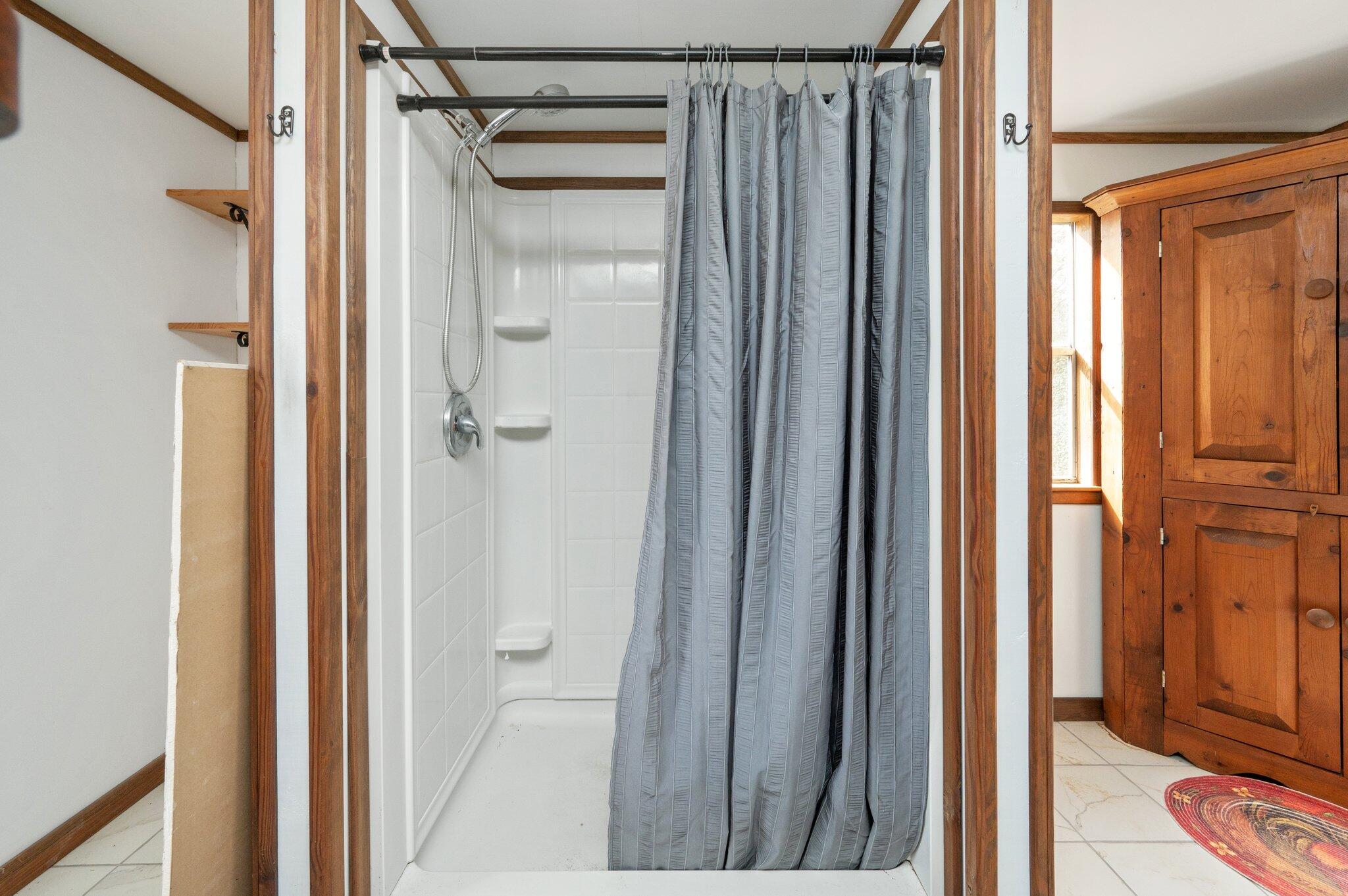 4507 Rainbird Rise Road Crestview, FL 32539 - Photo 18 of 33 a view of bathroom with a shower and a glass door