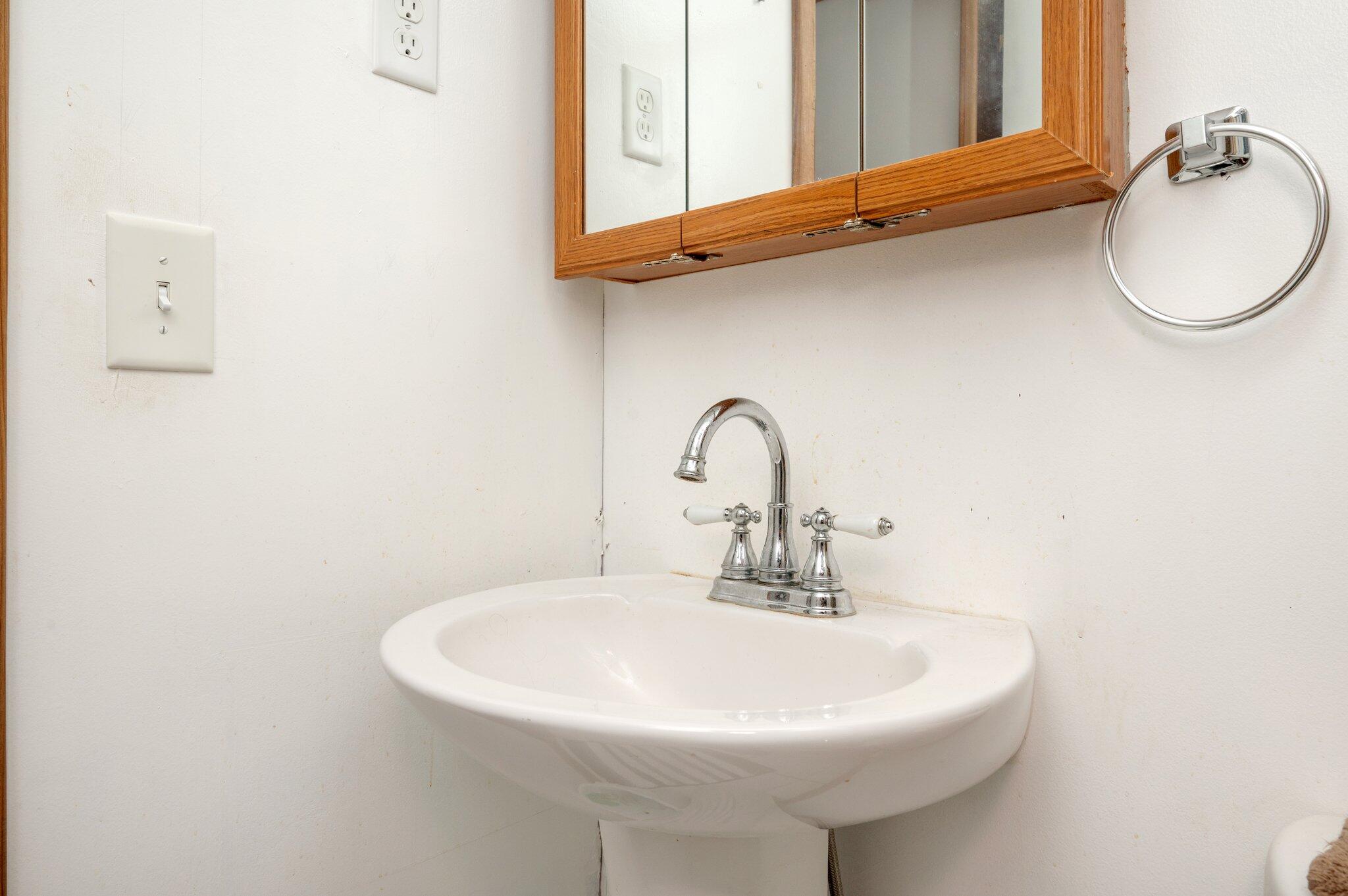 4507 Rainbird Rise Road Crestview, FL 32539 - Photo 21 of 33 a bathroom with a sink and a mirror