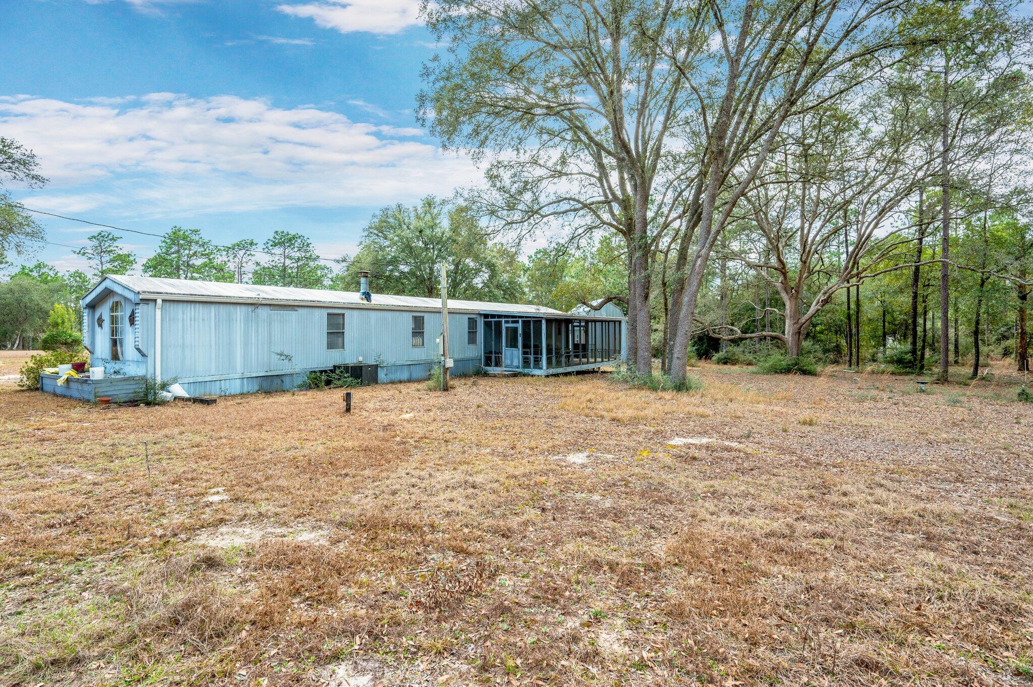 4507 Rainbird Rise Road Crestview, FL 32539 - Photo 26 of 33 front view of a house with a yard