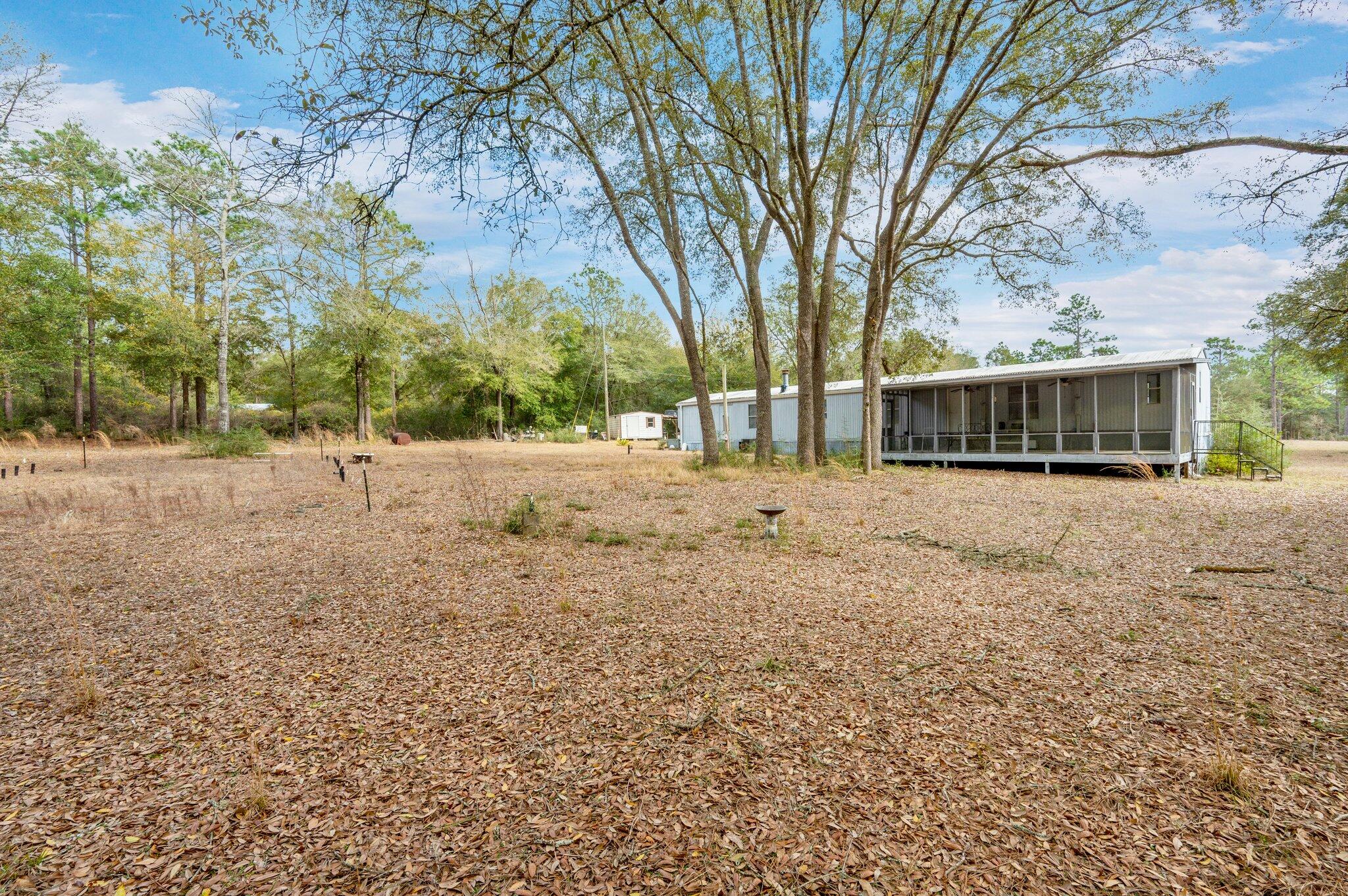 4507 Rainbird Rise Road Crestview, FL 32539 - Photo 27 of 33 a view of large trees with yard