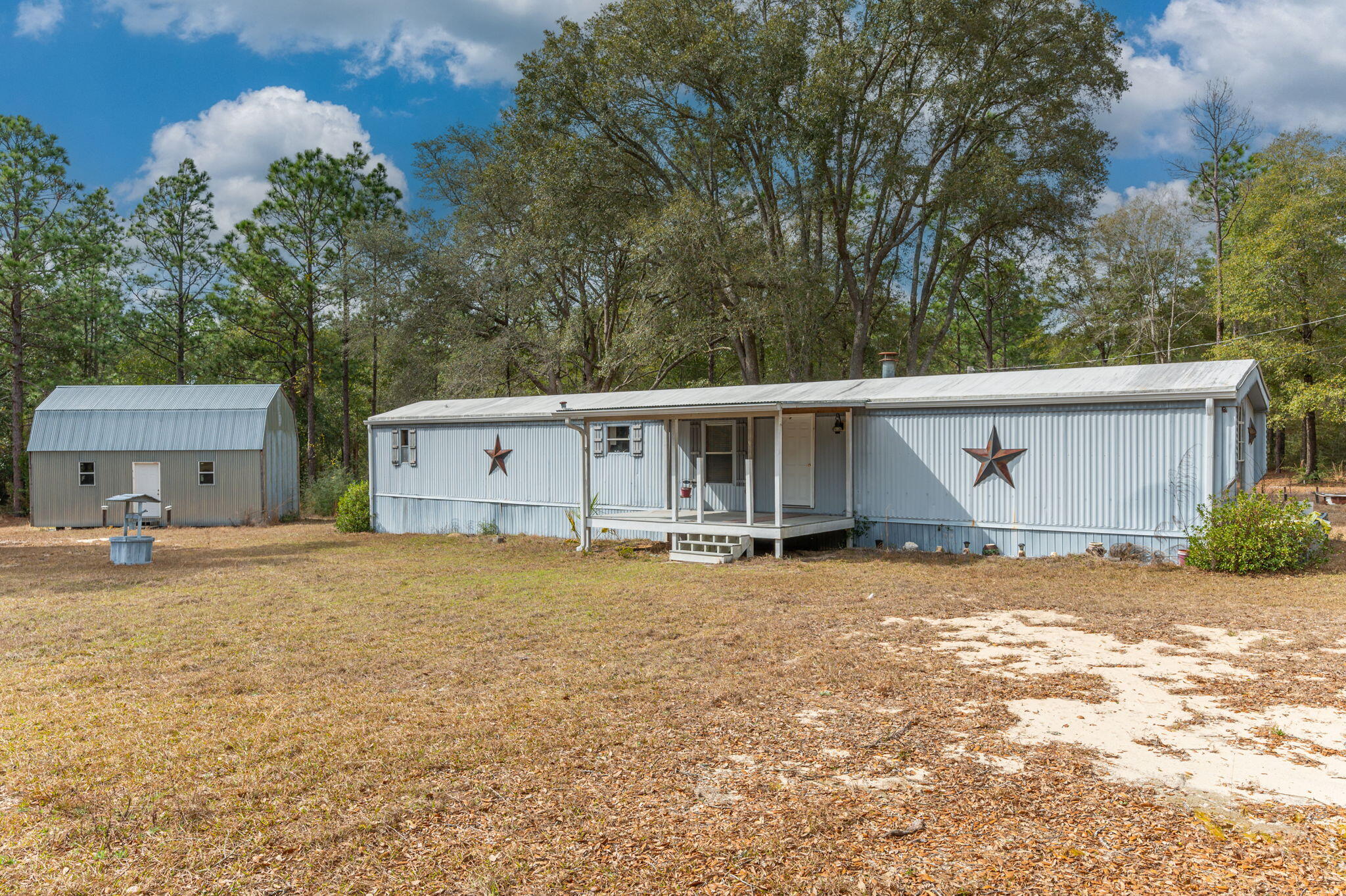 4507 Rainbird Rise Road Crestview, FL 32539 - Photo 3 of 33 a view of a house with a yard and large tree