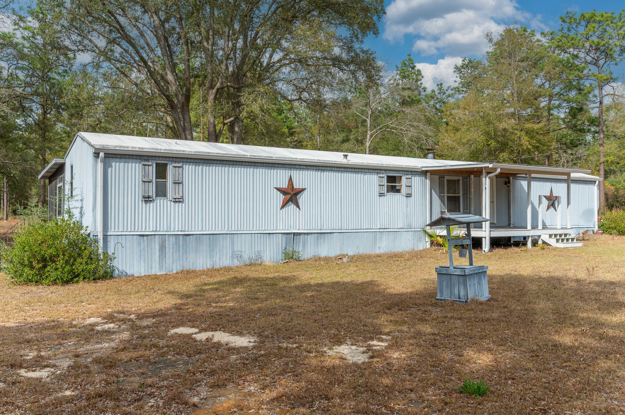 4507 Rainbird Rise Road Crestview, FL 32539 - Photo 4 of 33 a view of a backyard with garage